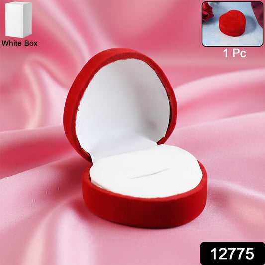 Open velvet ring box showing smooth white cushioned interior holding ring securely