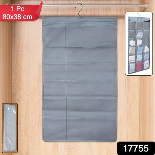 Open multi-pocket hanging under garment organizer inside a closet