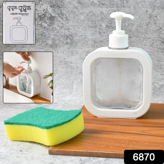 Refillable clear soap dispenser placed on a modern bathroom vanity with a faucet.