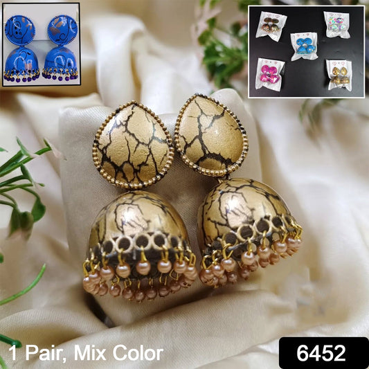 Model showcasing elegant Jhumka Earrings with a traditional Indian outfit, highlighting their festive appeal.